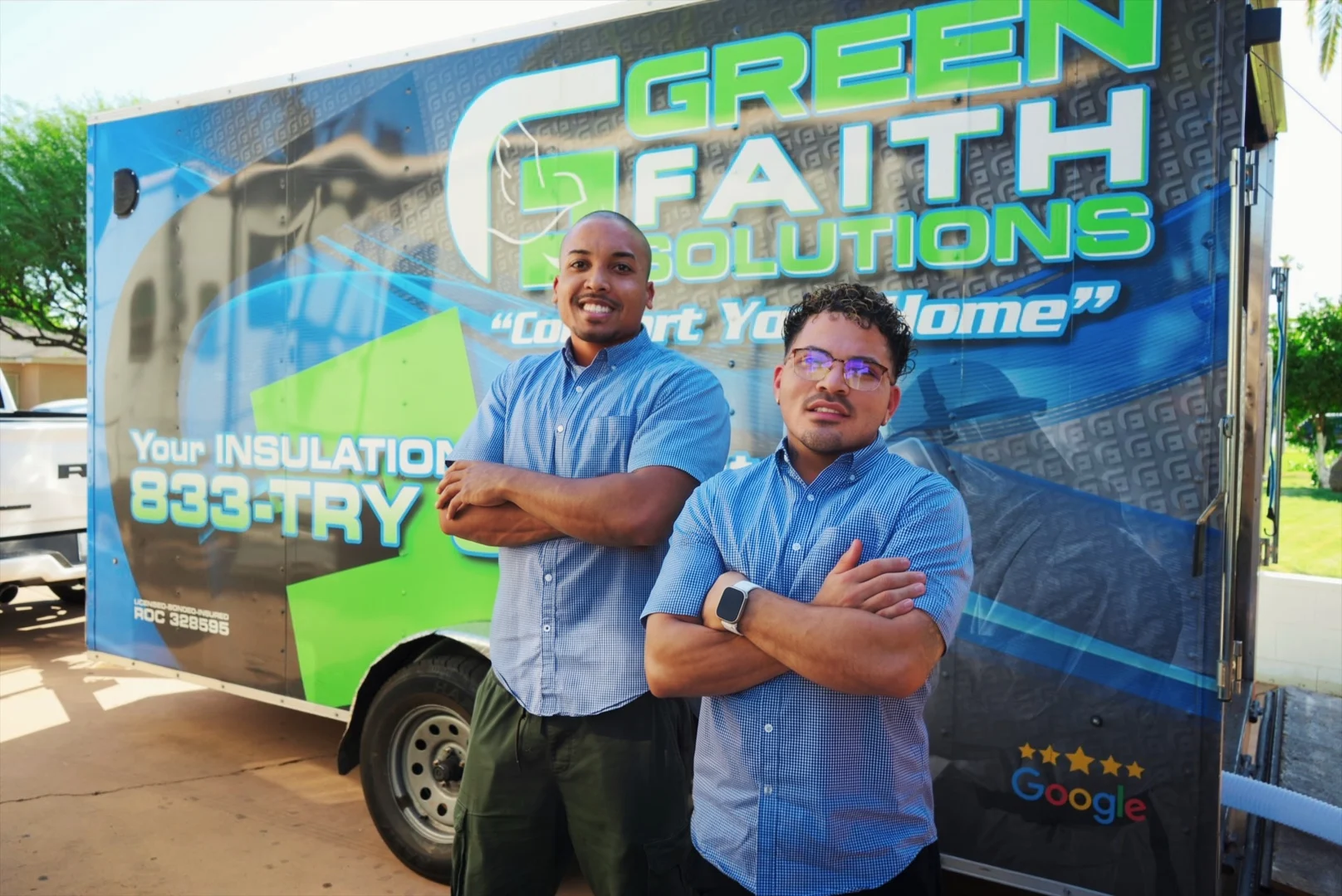 Green Faith Solutions team members beside the company trailer